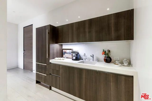 a spacious bedroom with a bed and a large window