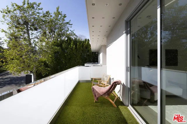 a bedroom with a bed and dresser