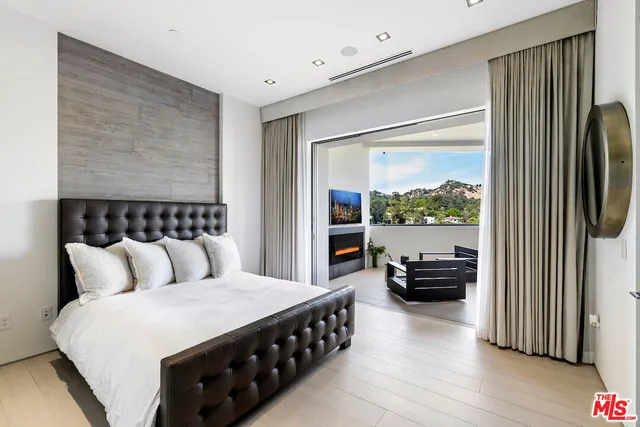 a terrace with outdoor seating and city view