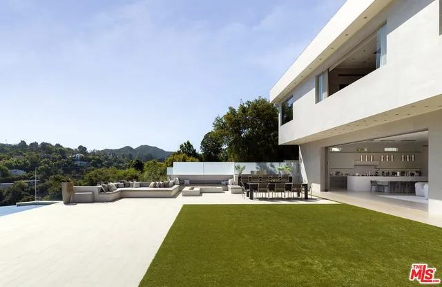 a view of a swimming pool and lounge chair