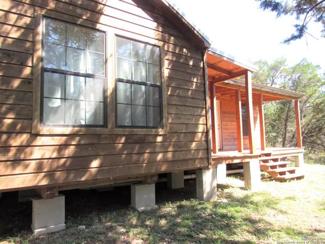 a view of a brick house with many windows