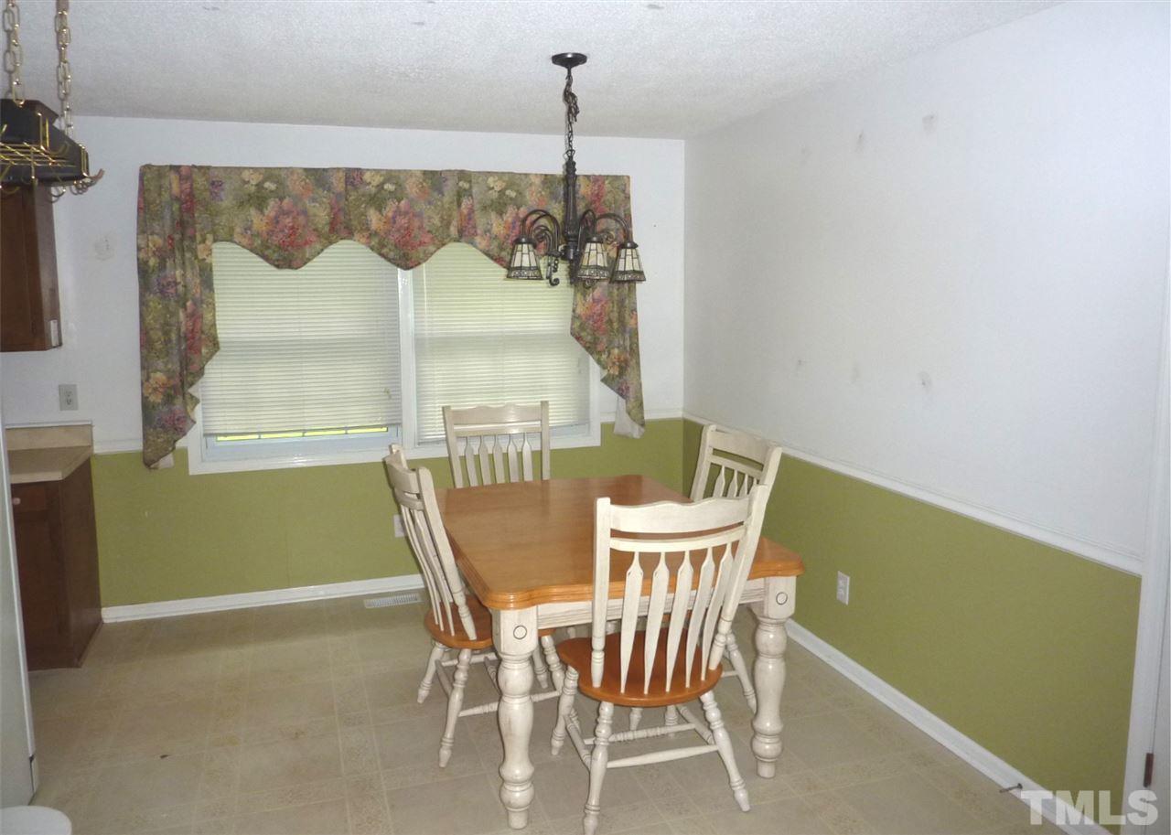 7201 Perry Creek Road Raleigh, NC 27616 - Photo 7 of 16 Just off of dining is a pantry and laundry.