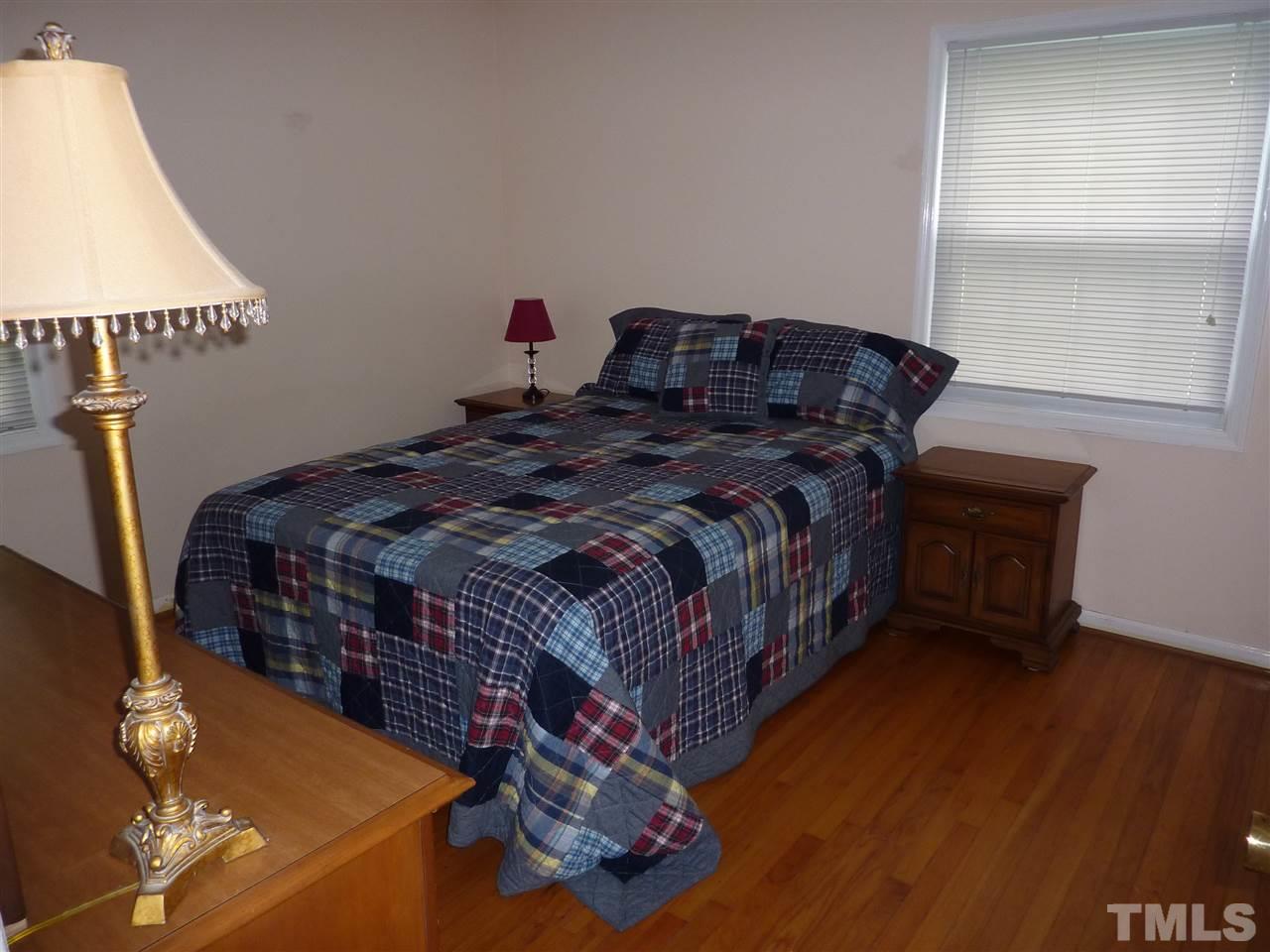 7201 Perry Creek Road Raleigh, NC 27616 - Photo 8 of 16 Master bed with hardwoods and private half bath.
