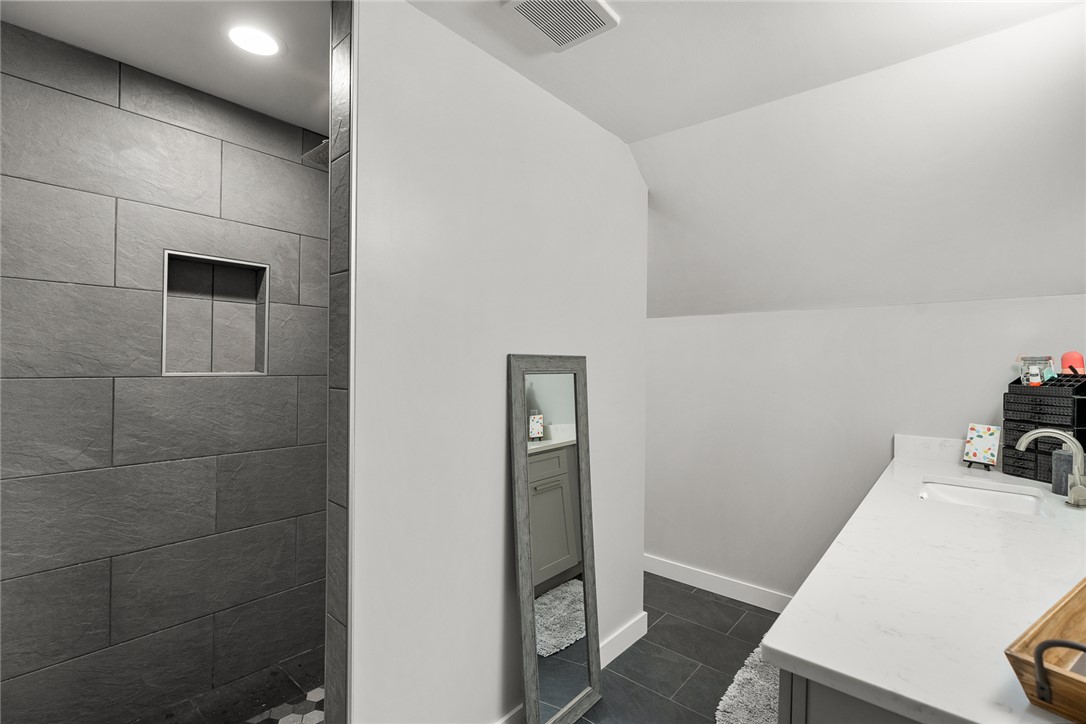 140 Turnberry Road Anderson, SC 29621 - Photo 21 of 44 This bathroom features a contemporary shower and a sleek vanity, offering modern comfort and style.