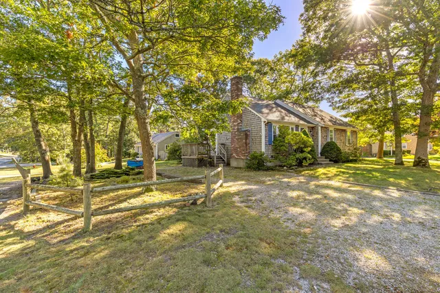 a view of a trees in front of a house