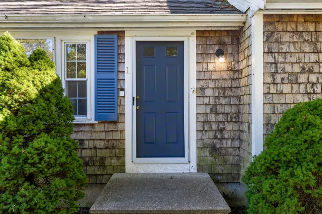 a view of front door of house and tree