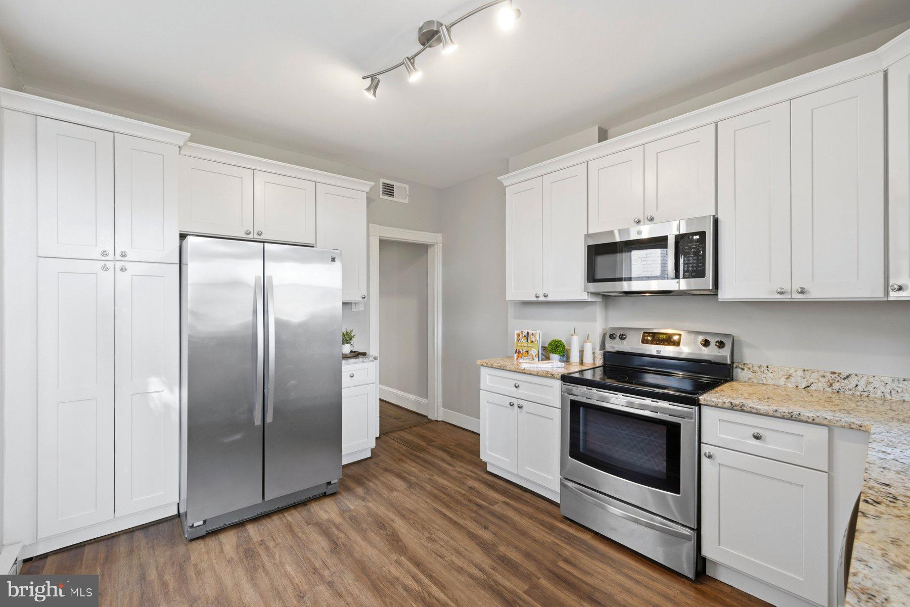 316 East 3rd Street Frederick, MD 21701 - Photo 16 of 41 Modern kitchen with sleek finishes.