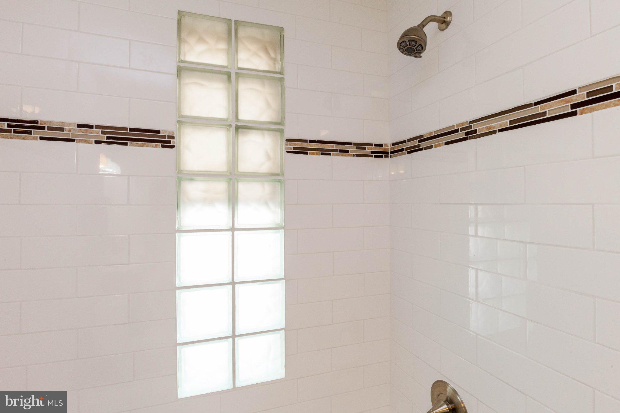 316 East 3rd Street Frederick, MD 21701 - Photo 23 of 41 Modern shower with elegant tile accents.