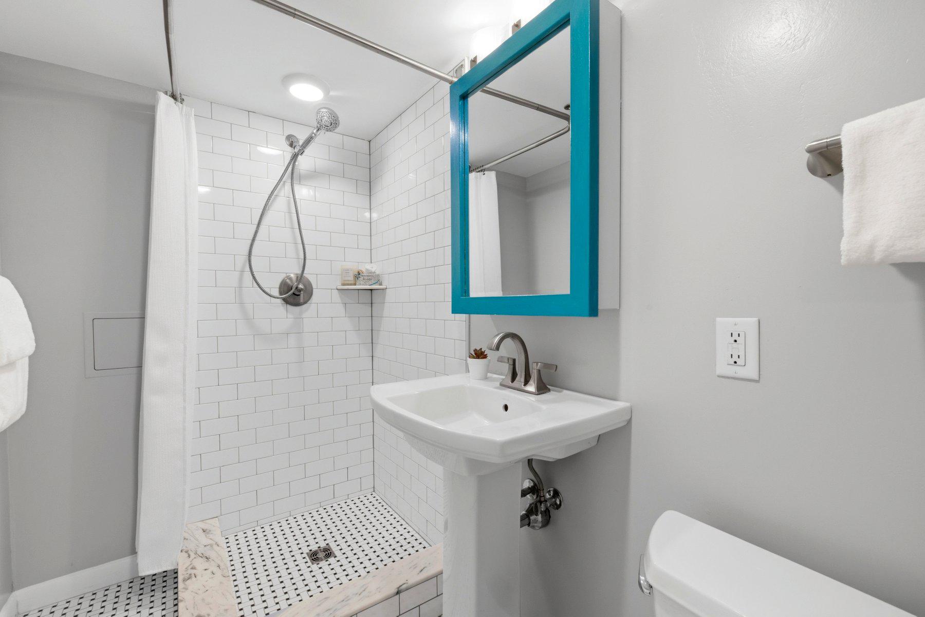 316 East 3rd Street Frederick, MD 21701 - Photo 32 of 41 Chic basement bathroom with vibrant accents.
