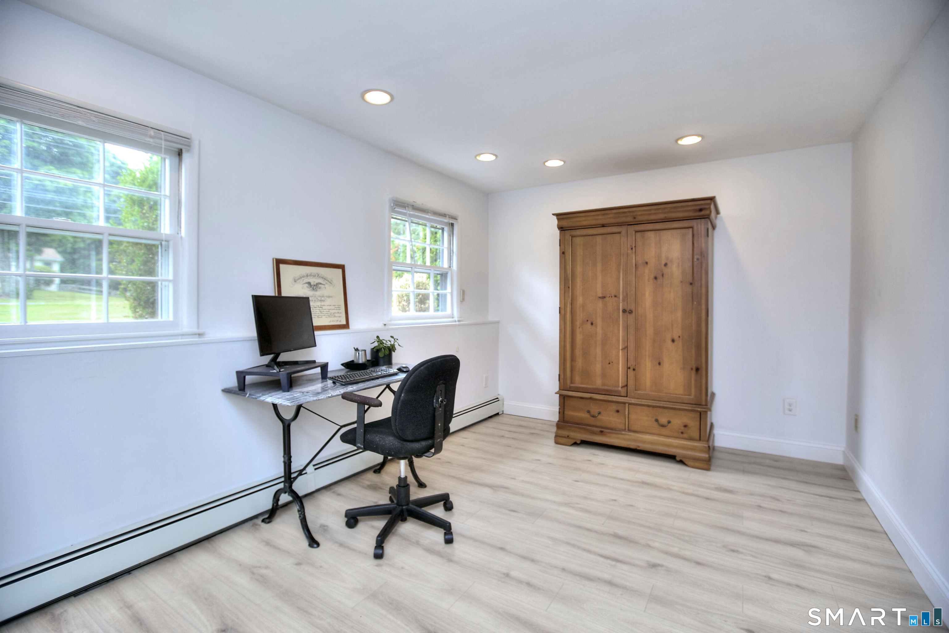 324 Ridge Road Orange, CT 06477 - Photo 20 of 38 a view of a workspace with furniture and a window