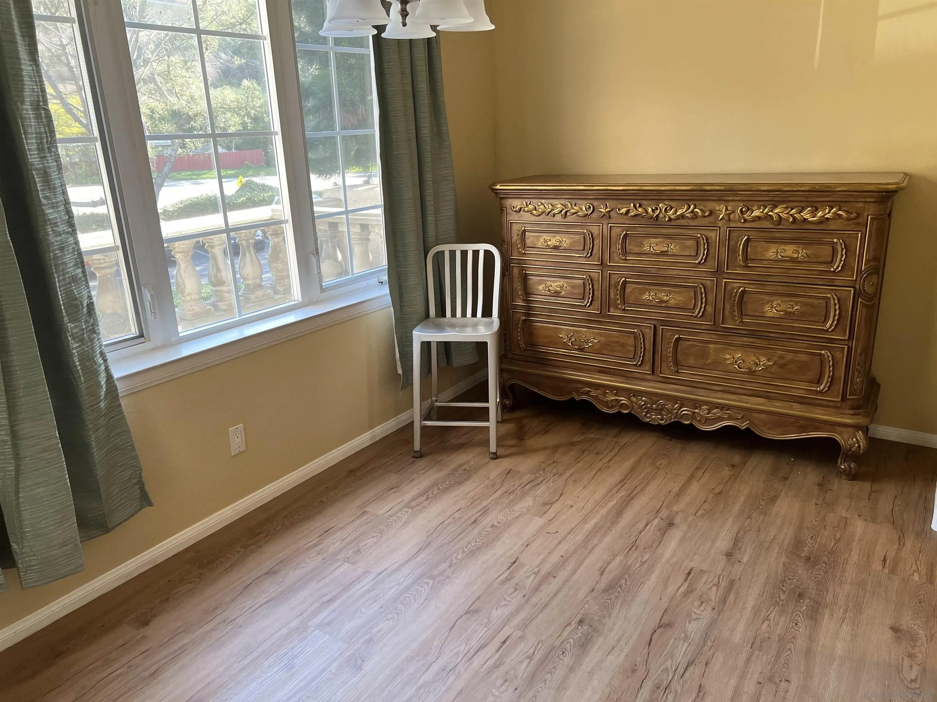 2834 Torrey Pines Road La Jolla, CA 92037 - Photo 13 of 15 a living room with hard wood floors and a window