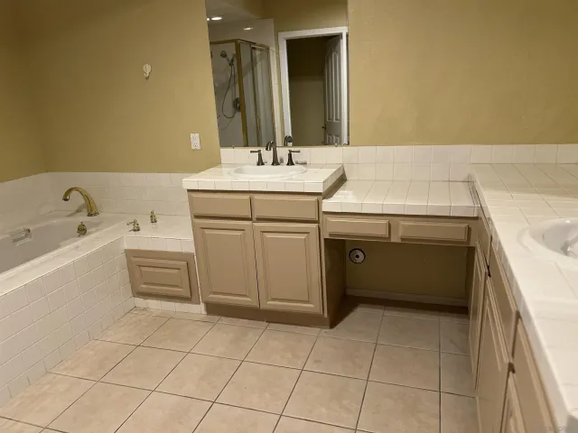 a utility room with a sink washer and dryer