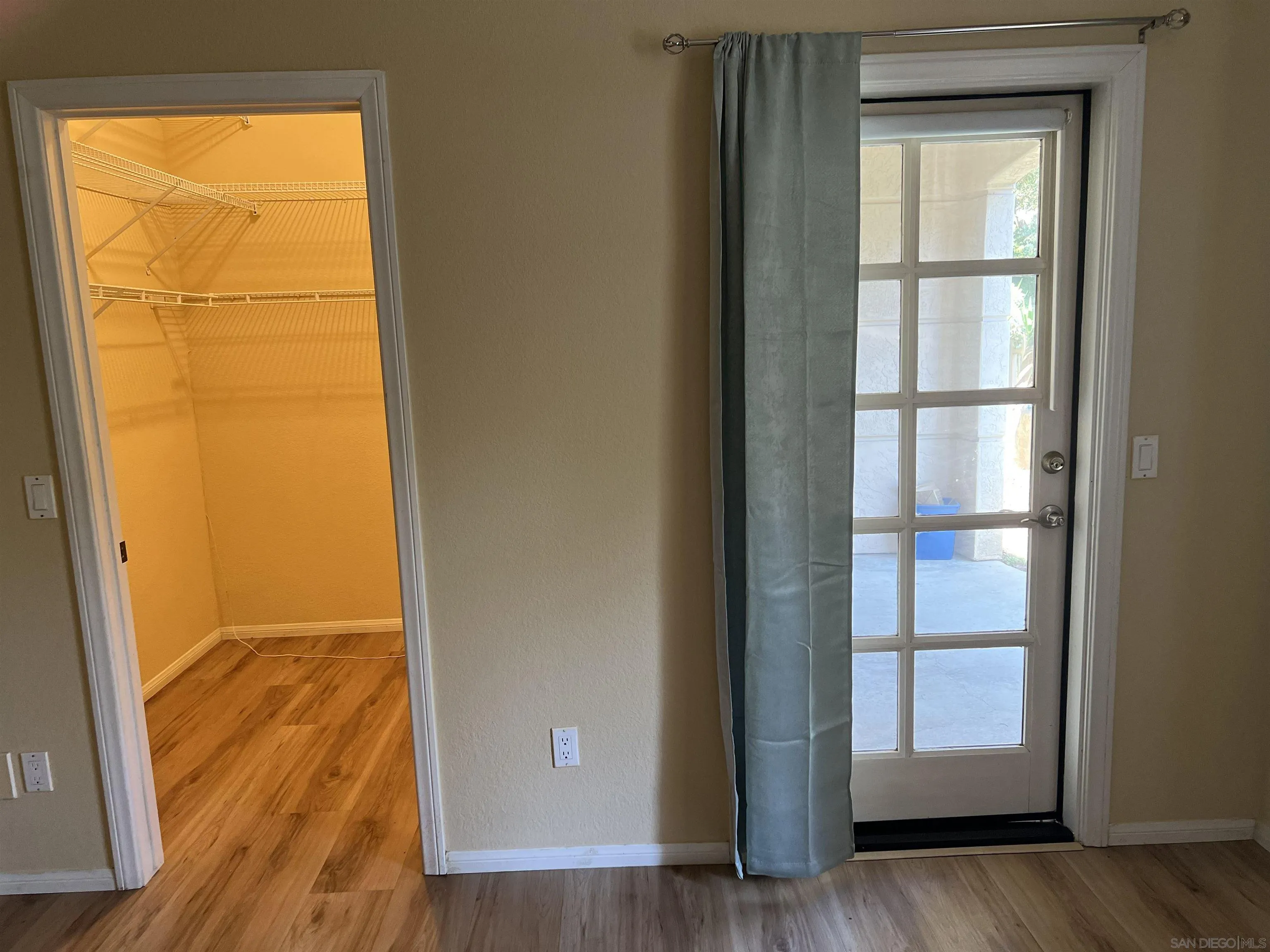 2834 Torrey Pines Road La Jolla, CA 92037 - Photo 8 of 15 a view of an empty room with wooden floor and a window