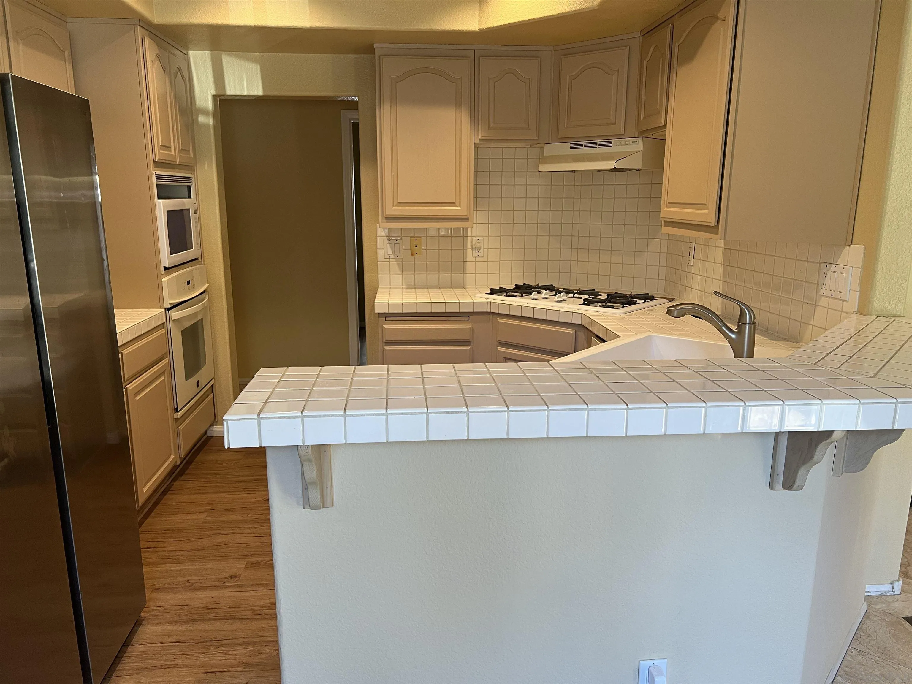 2834 Torrey Pines Road La Jolla, CA 92037 - Photo 10 of 15 a kitchen with a sink and refrigerator