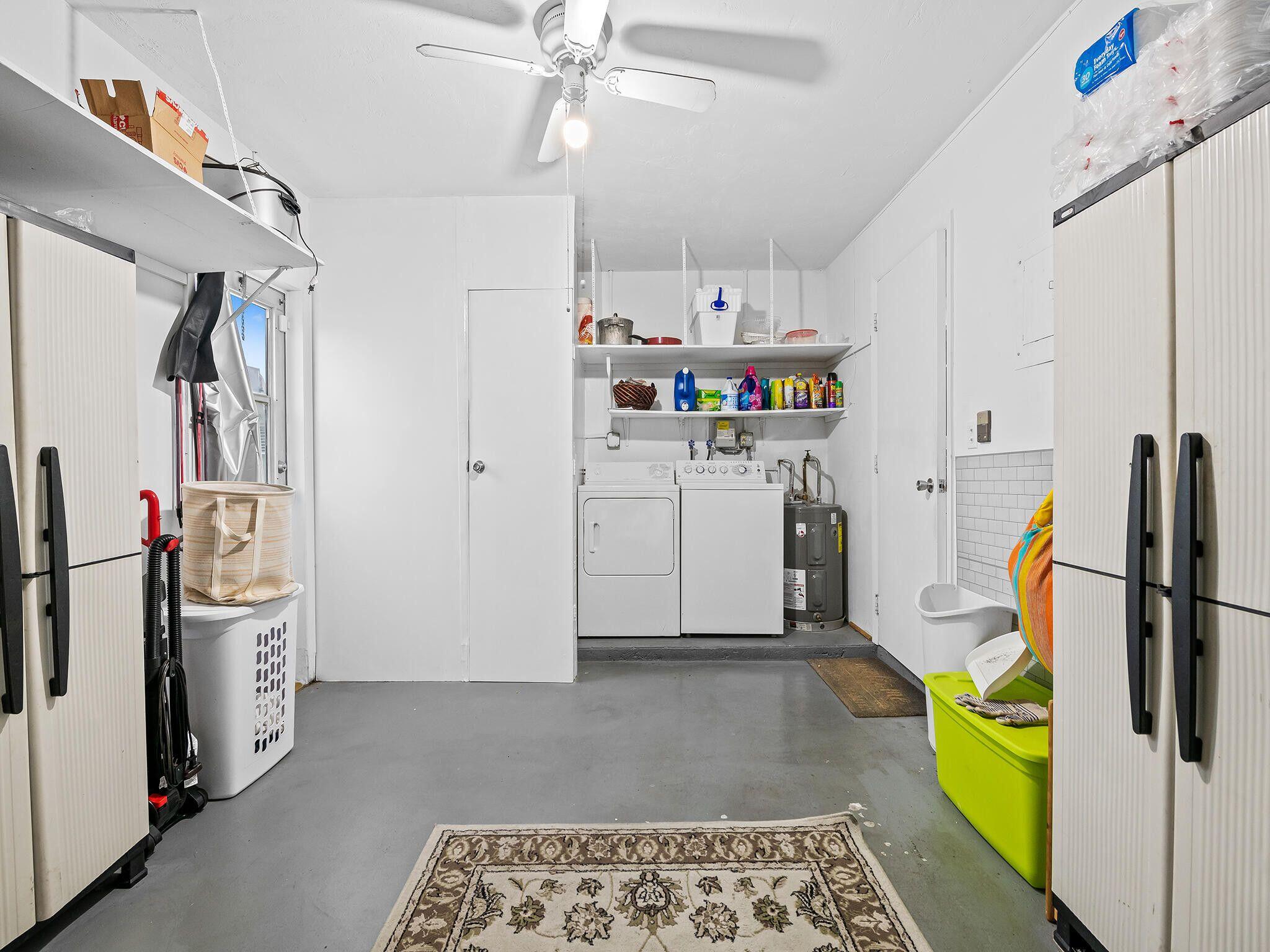210 Northwest 25th Court Pompano Beach, FL 33064 - Photo 17 of 17 a utility room with cabinets dryer and washer