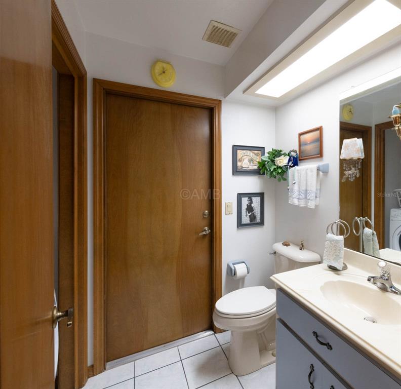2298 West Pine Ridge Boulevard Beverly Hills, FL 34465 - Photo 12 of 34 a bathroom with a granite countertop sink toilet and shower