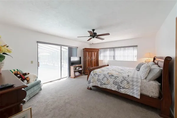 a large white kitchen with a refrigerator a sink dishwasher and a large mirror