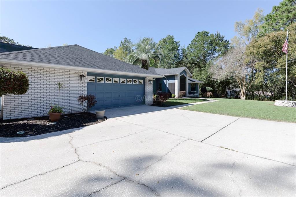 2298 West Pine Ridge Boulevard Beverly Hills, FL 34465 - Photo 34 of 34 a front view of house with yard