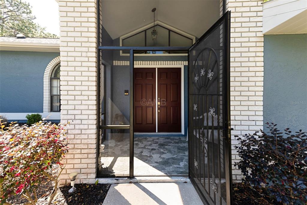 2298 West Pine Ridge Boulevard Beverly Hills, FL 34465 - Photo 5 of 34 a view of a door of the house