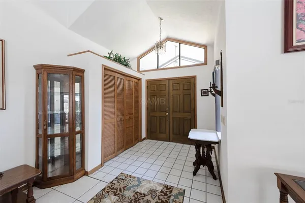 a large kitchen with a stove a refrigerator and a sink