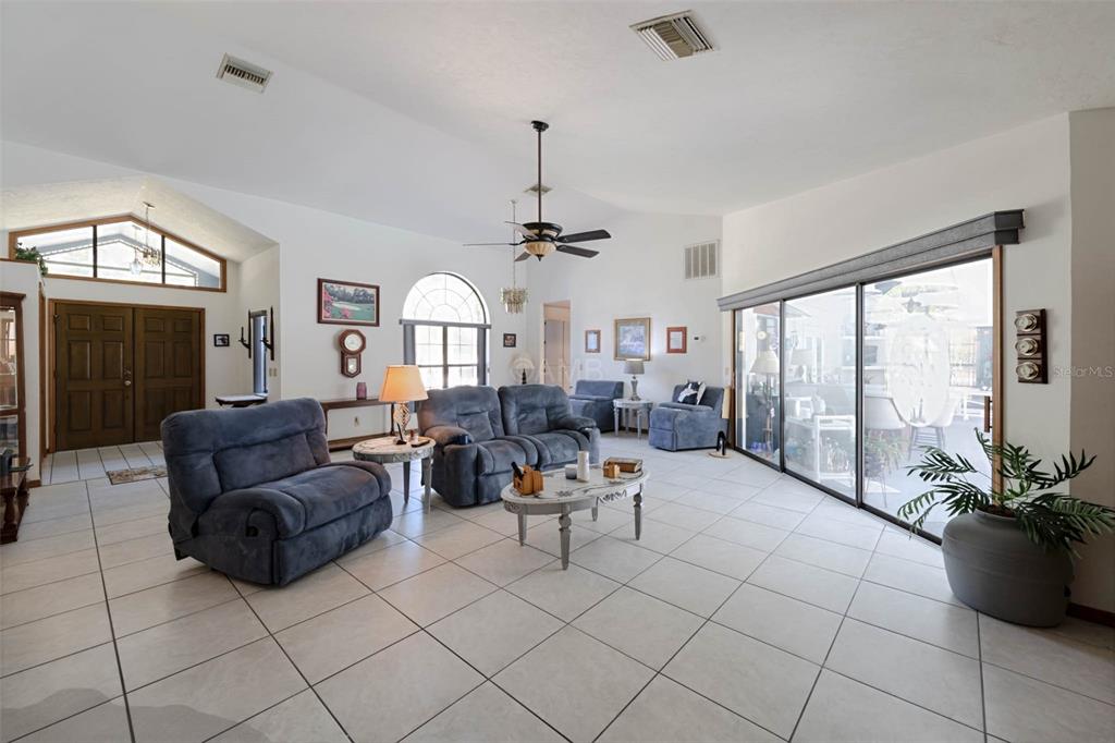 2298 West Pine Ridge Boulevard Beverly Hills, FL 34465 - Photo 7 of 34 a living room with furniture and a large window