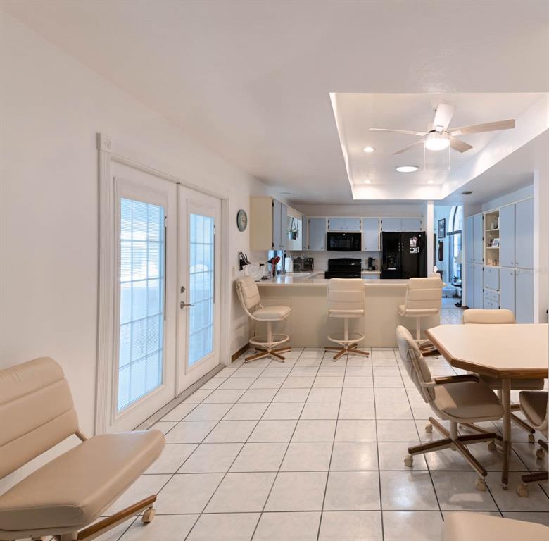 2298 West Pine Ridge Boulevard Beverly Hills, FL 34465 - Photo 10 of 34 a living room with a couch and a view of dining room