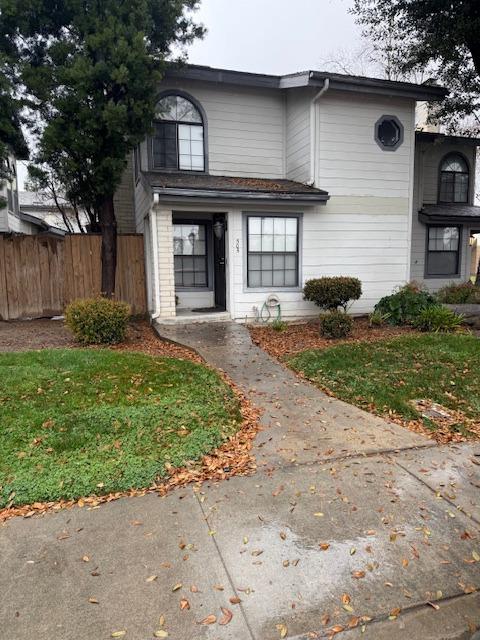 505 South Del Norte Avenue Kerman, CA 93630 - Photo 1 of 12 a front view of a house with a yard and garage