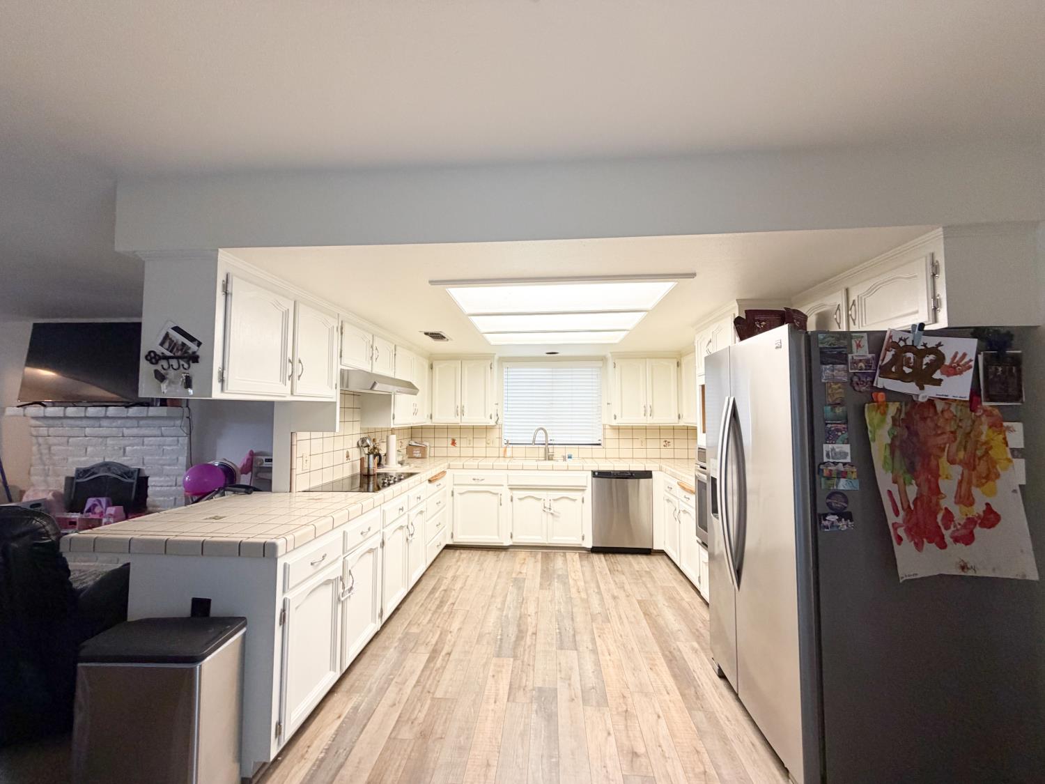 505 South Del Norte Avenue Kerman, CA 93630 - Photo 5 of 12 a large kitchen with a lot of counter space and appliances