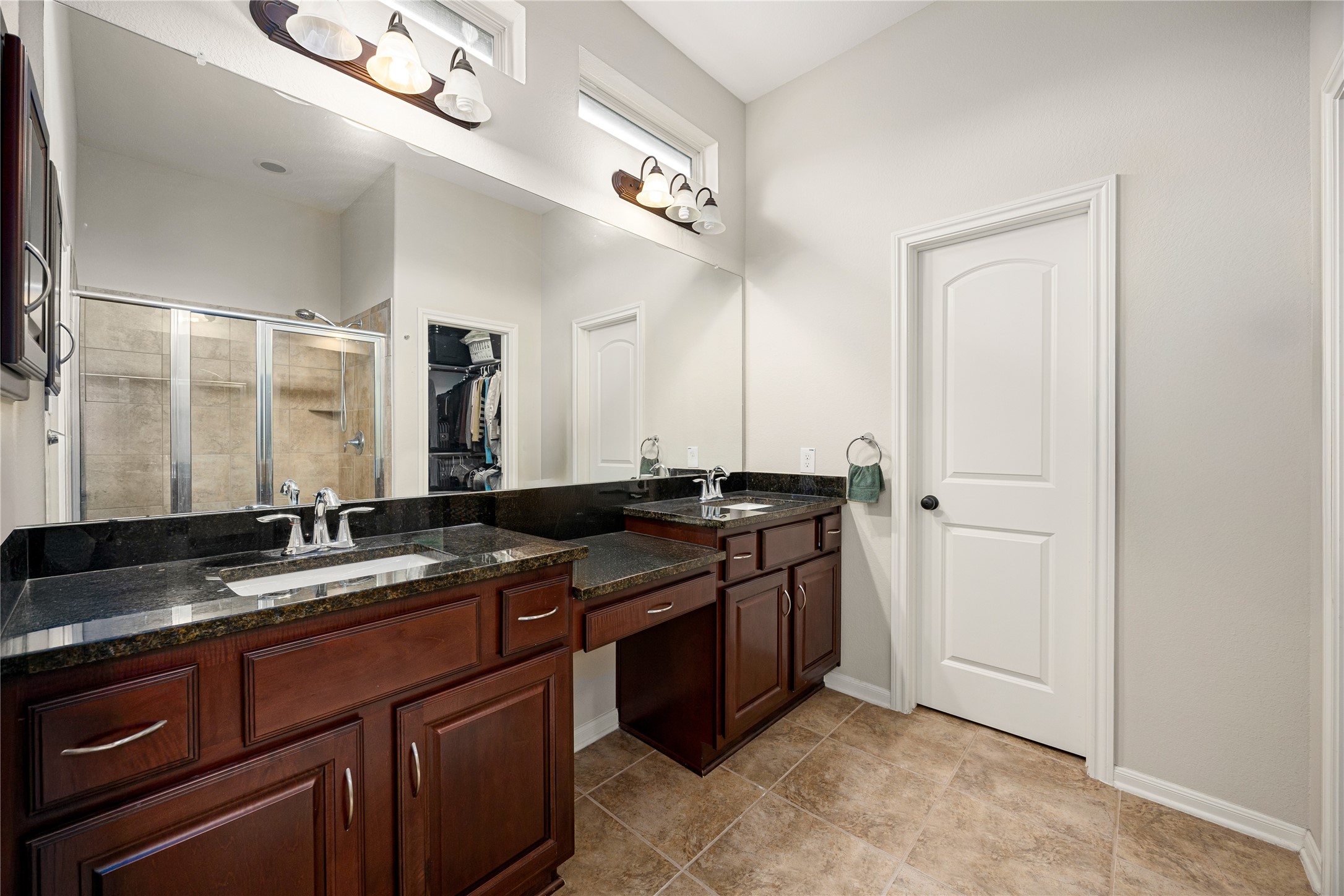 22 South Marshside Place Spring, TX 77389 - Photo 23 of 43 a bathroom with a granite countertop sink and a mirror