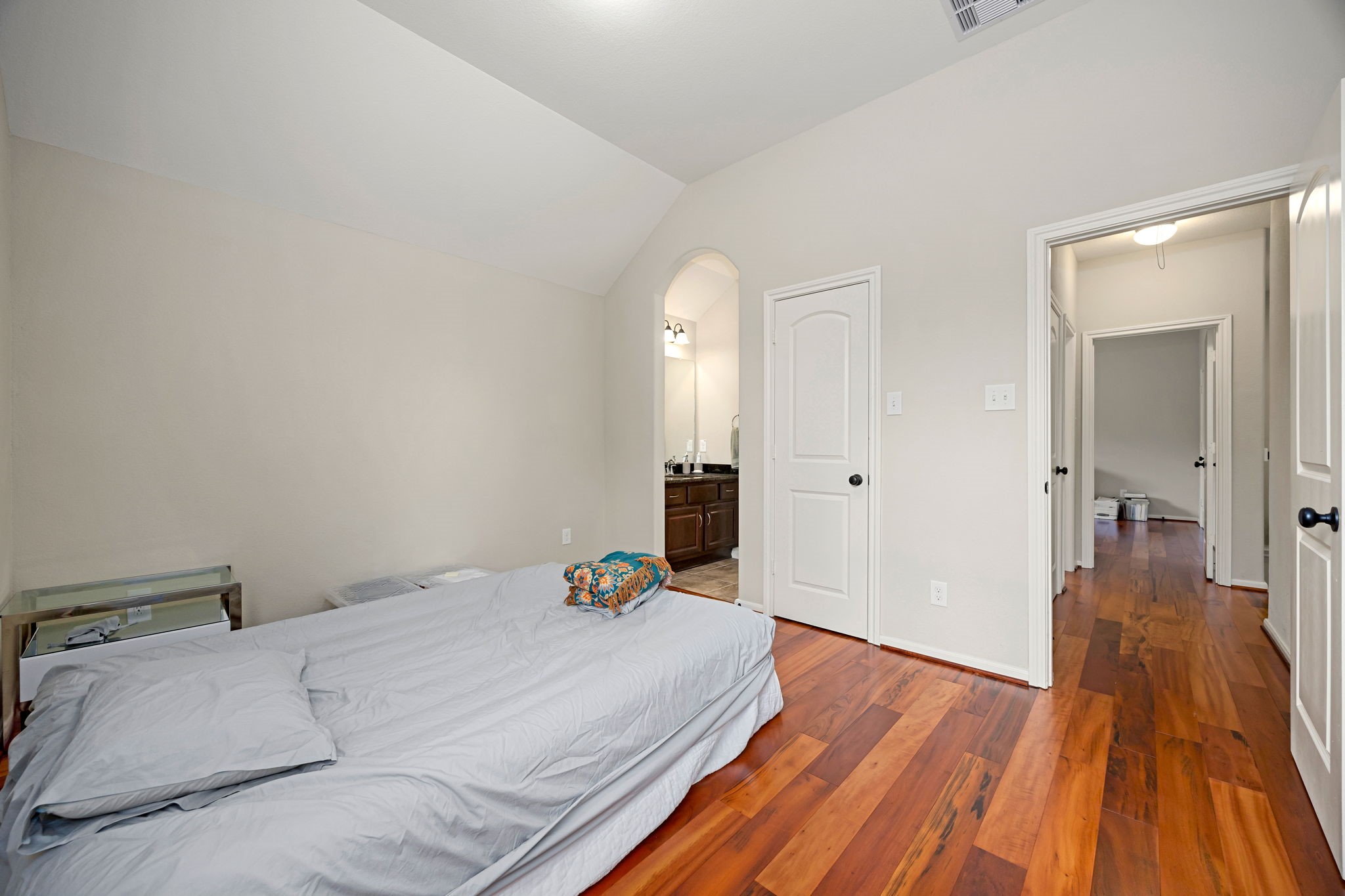 22 South Marshside Place Spring, TX 77389 - Photo 33 of 43 a bed room with a bed and wooden floor