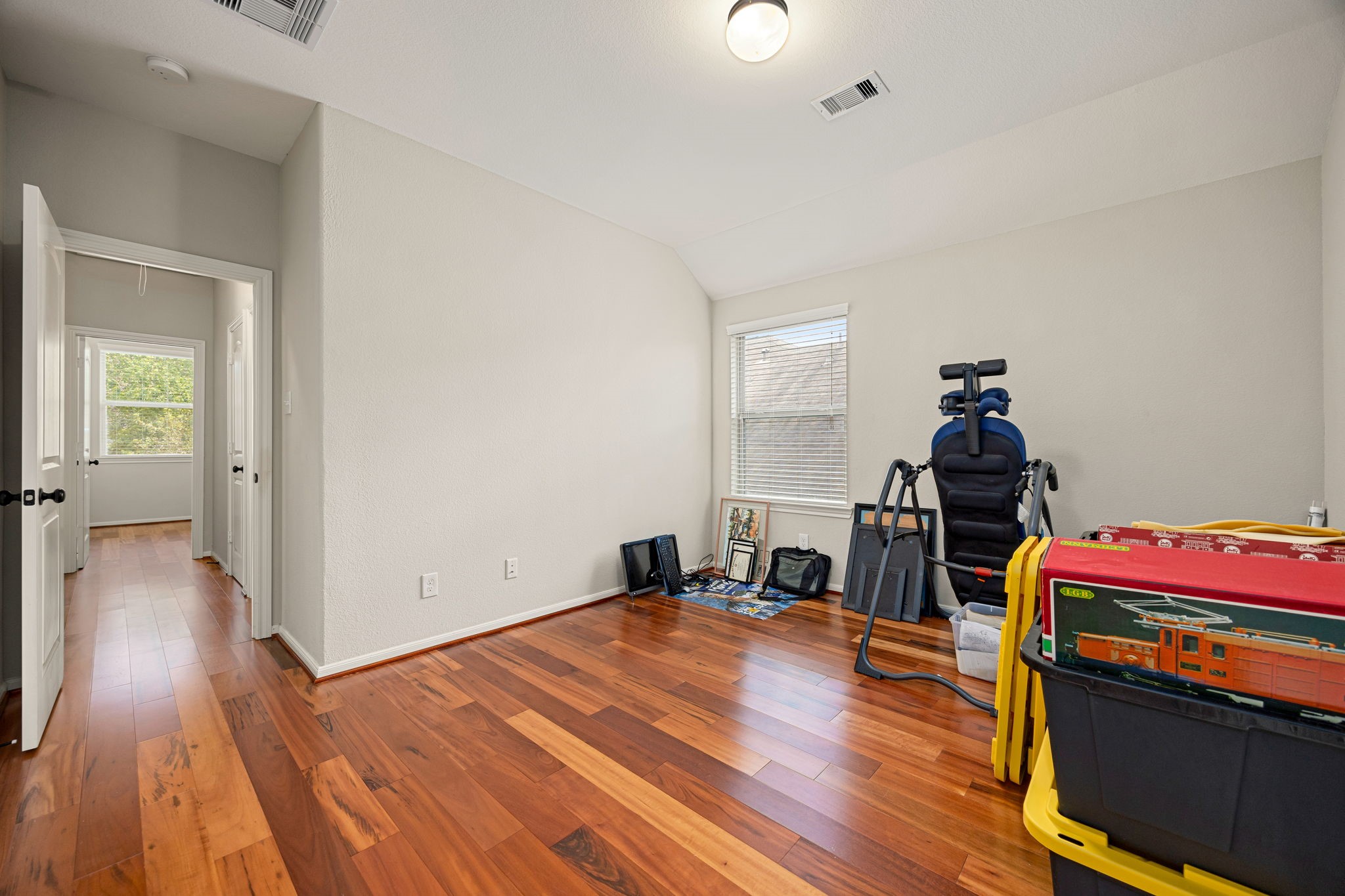 22 South Marshside Place Spring, TX 77389 - Photo 35 of 43 a room with wooden floor and shoes