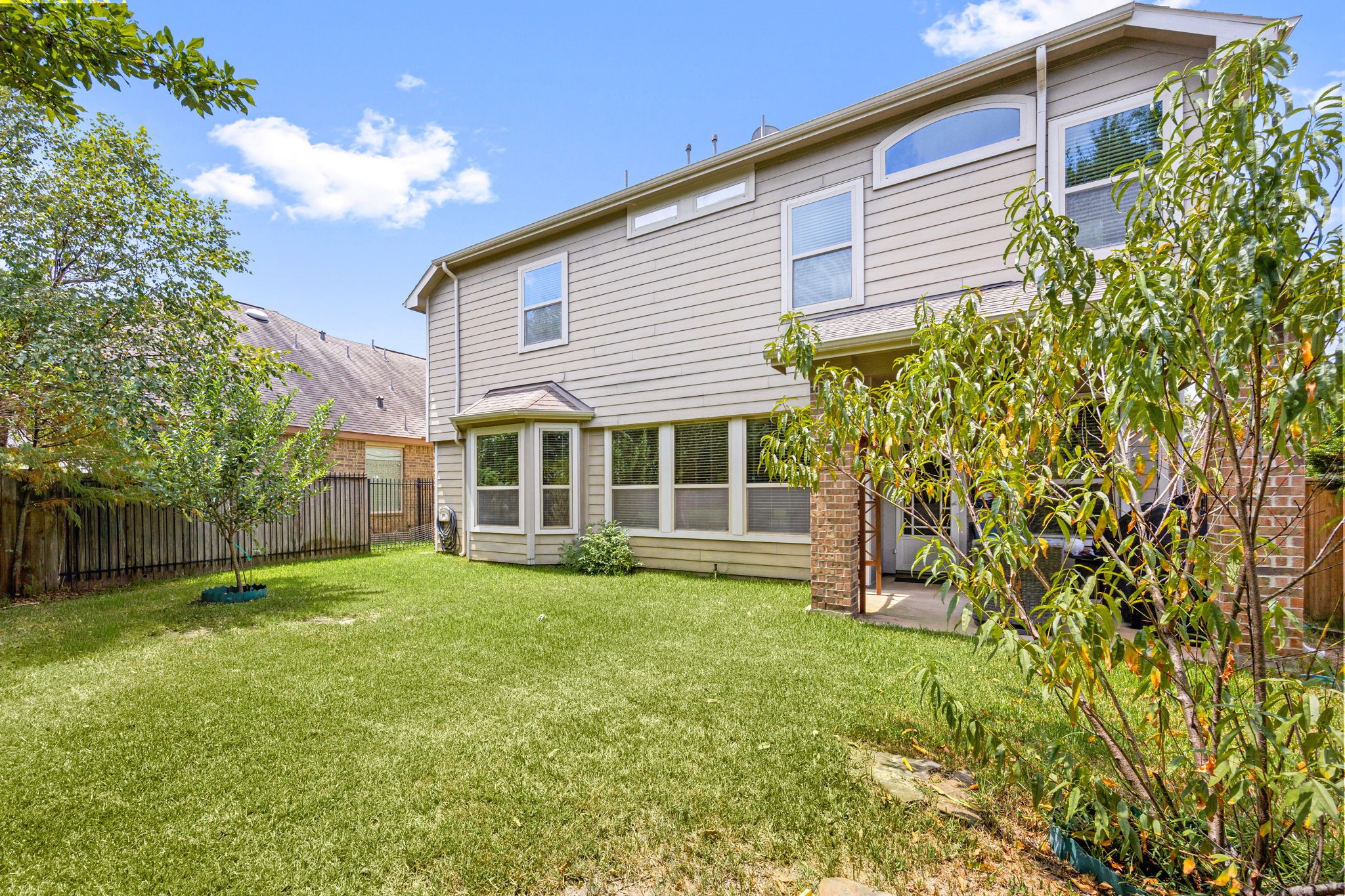 22 South Marshside Place Spring, TX 77389 - Photo 42 of 43 a view of a house with a yard