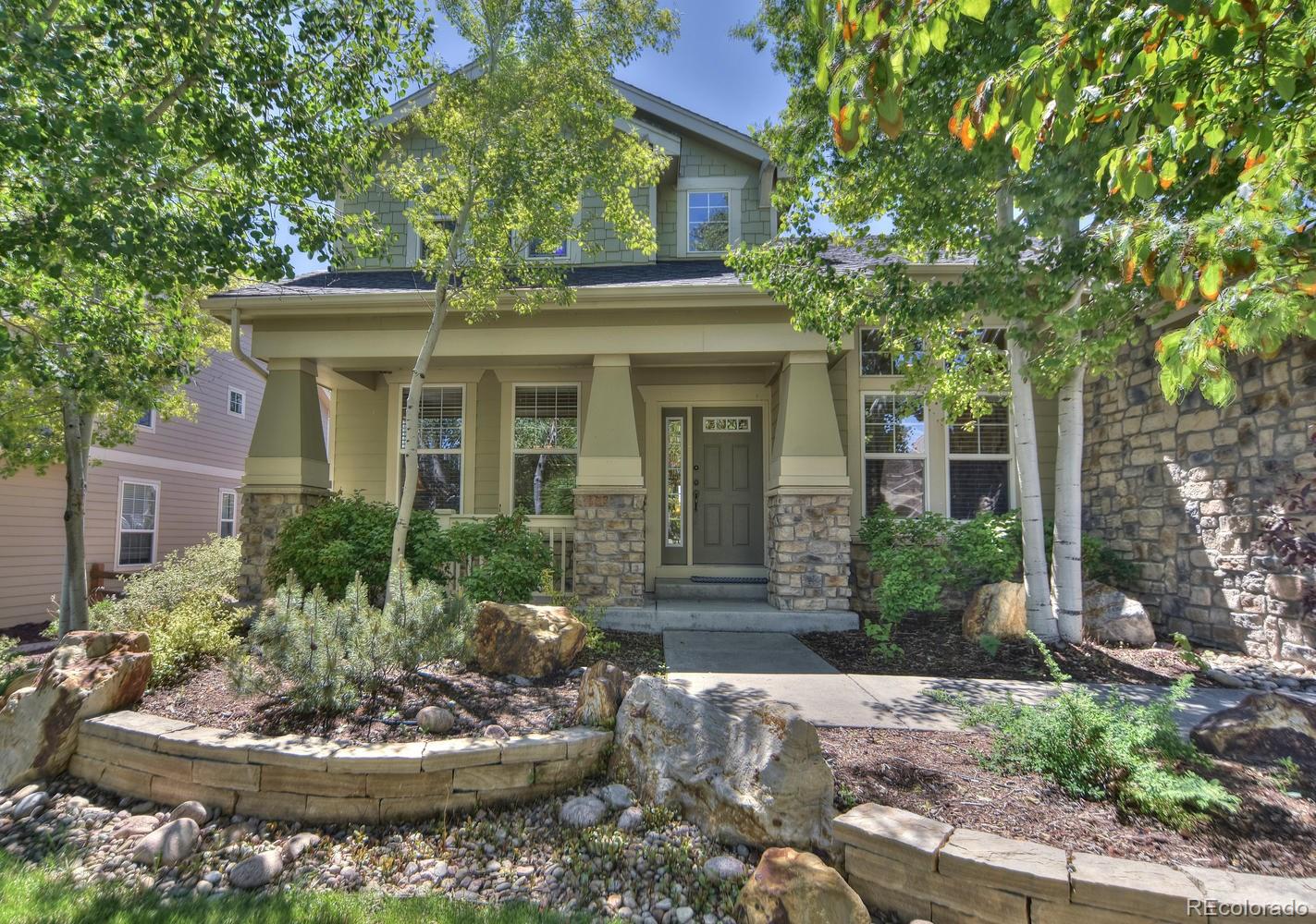 4464 Eagle River Run Broomfield, CO 80023 - Photo 2 of 32 a view of a house with a yard and potted plants