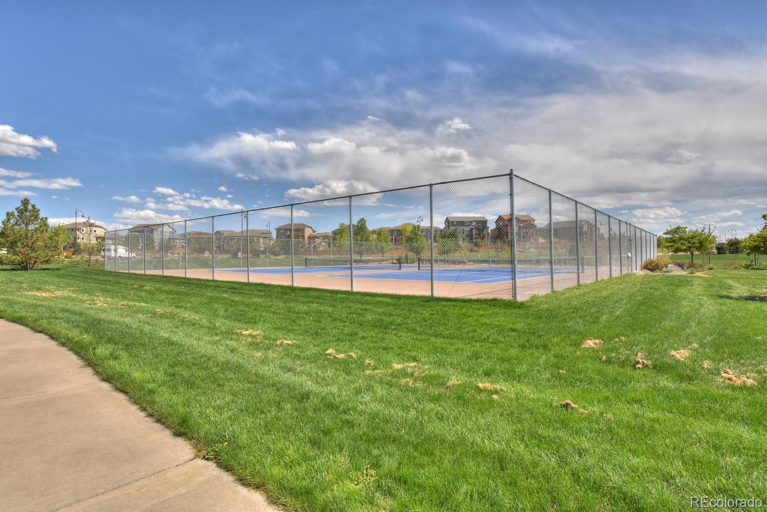 4464 Eagle River Run Broomfield, CO 80023 - Photo 30 of 32 a view of a garden and basketball court