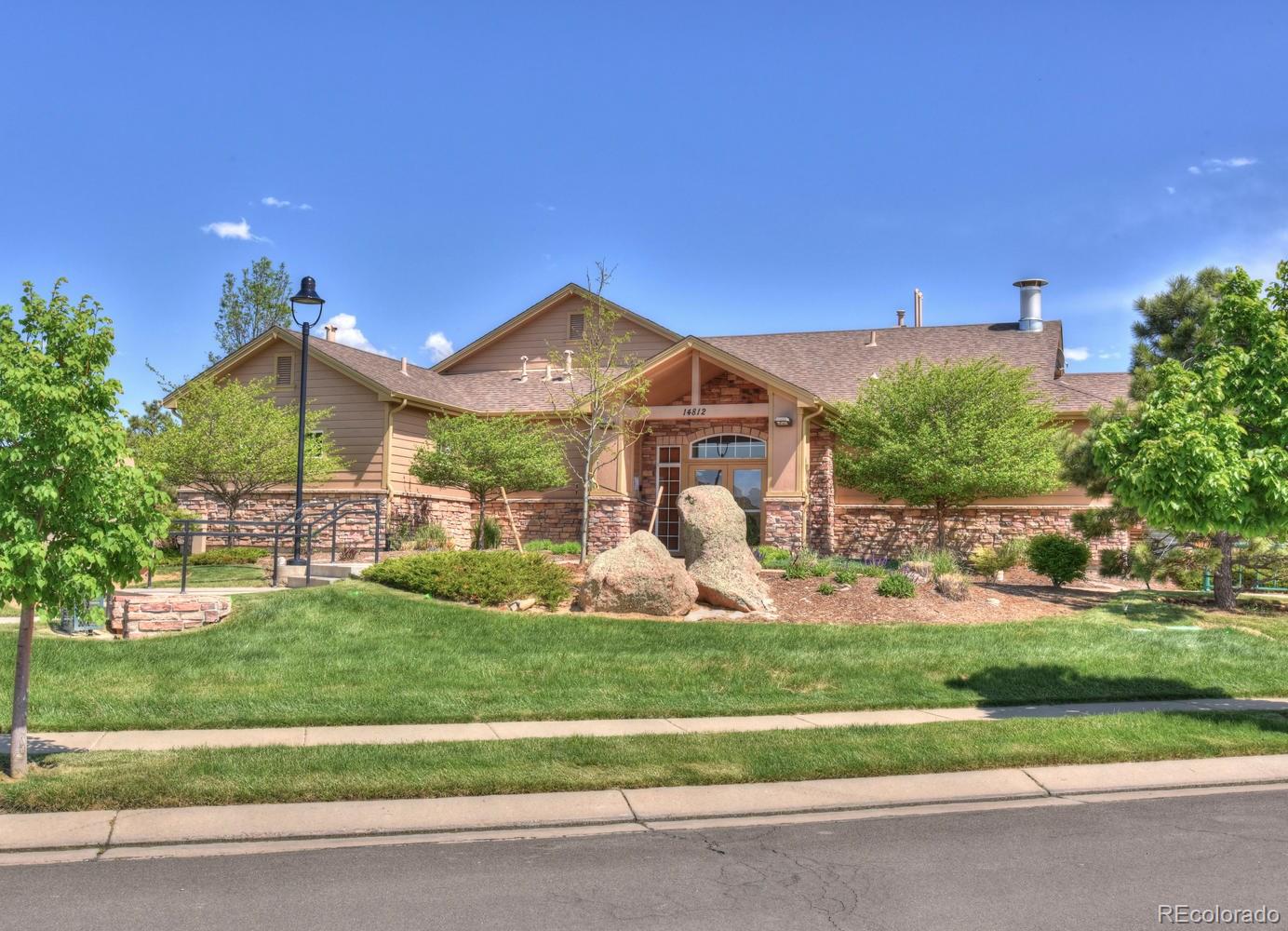 4464 Eagle River Run Broomfield, CO 80023 - Photo 31 of 32 a front view of a house with garden
