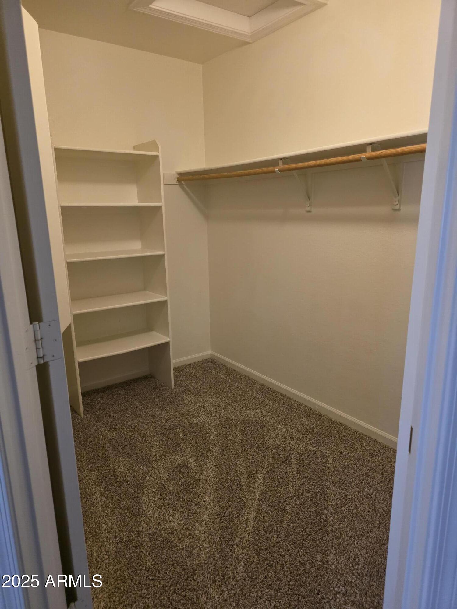 8758 West Bloomfield Road Peoria, AZ 85381 - Photo 13 of 20 a view of an empty walk in closet