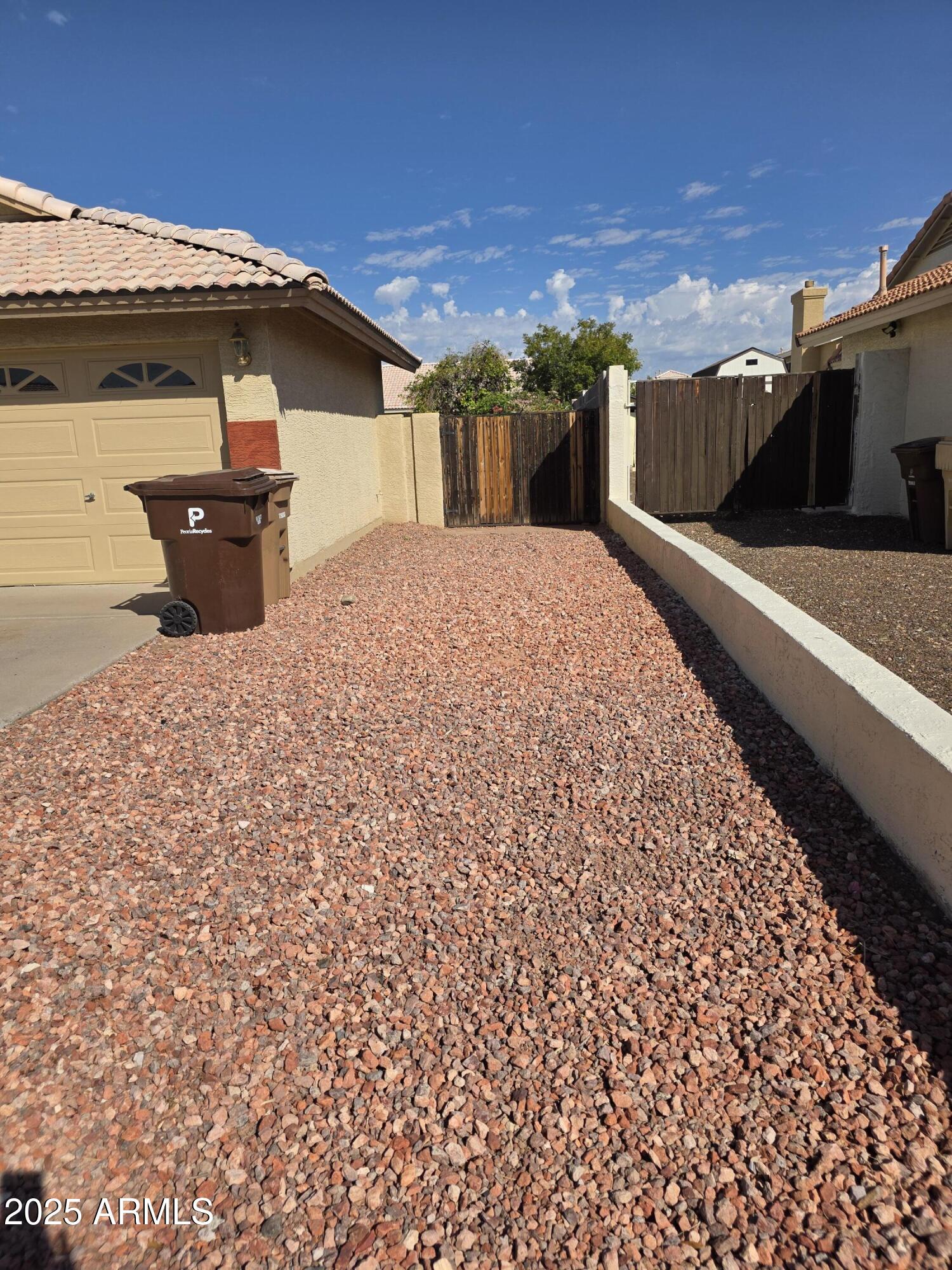 8758 West Bloomfield Road Peoria, AZ 85381 - Photo 17 of 20 a front view of a house with a yard