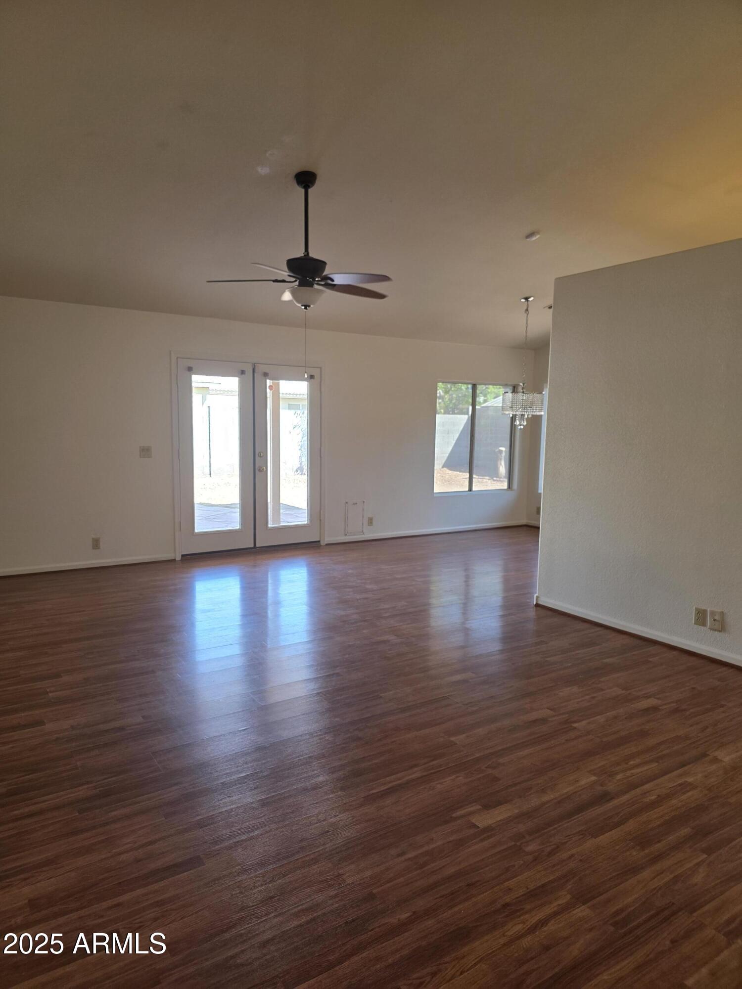 8758 West Bloomfield Road Peoria, AZ 85381 - Photo 8 of 20 a view of a livingroom with wooden floor