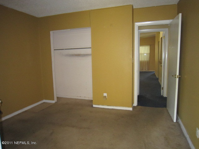 6958 Rollo Road Jacksonville, FL 32205 - Photo 8 of 8 a view of an empty room with closet area