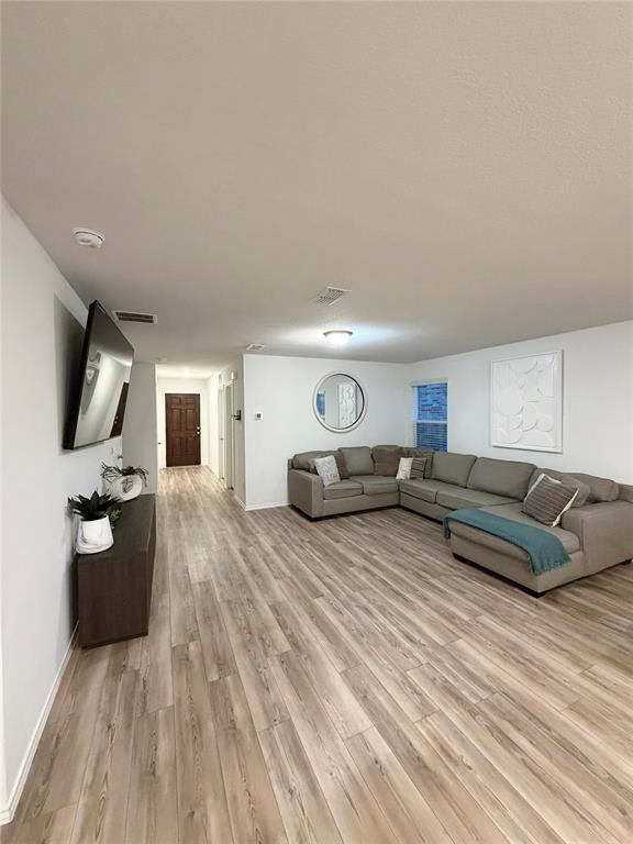 1129 Clear Dusk Lane Forney, TX 75126 - Photo 13 of 13 a living room with furniture and a flat screen tv