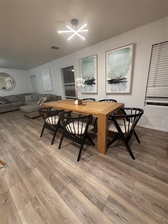 1129 Clear Dusk Lane Forney, TX 75126 - Photo 3 of 13 a view of a dining room with furniture window and wooden floor