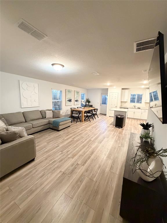 1129 Clear Dusk Lane Forney, TX 75126 - Photo 4 of 13 a living room with furniture and a couch