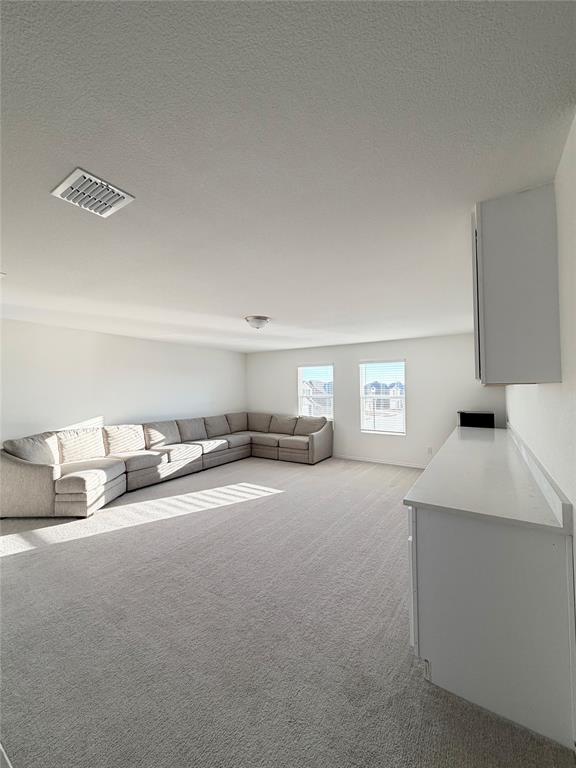 1129 Clear Dusk Lane Forney, TX 75126 - Photo 5 of 13 a living room with furniture and a window