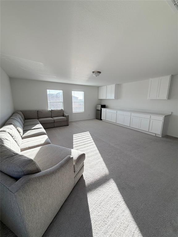 1129 Clear Dusk Lane Forney, TX 75126 - Photo 6 of 13 a living room with furniture and a couch