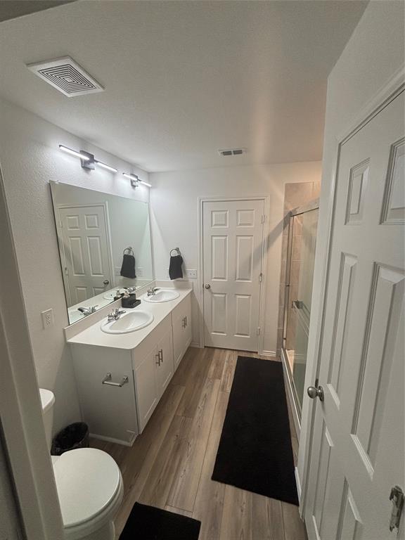 1129 Clear Dusk Lane Forney, TX 75126 - Photo 7 of 13 a bathroom with a sink a toilet a mirror and a tub