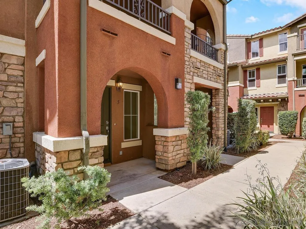 10214 Daybreak Lane, Unit 5 Santee, CA 92071 - Photo 2 of 38 a front view of a house with a yard