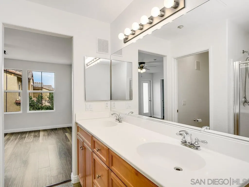 10214 Daybreak Lane, Unit 5 Santee, CA 92071 - Photo 23 of 38 a bathroom with a sink double vanity and a mirror