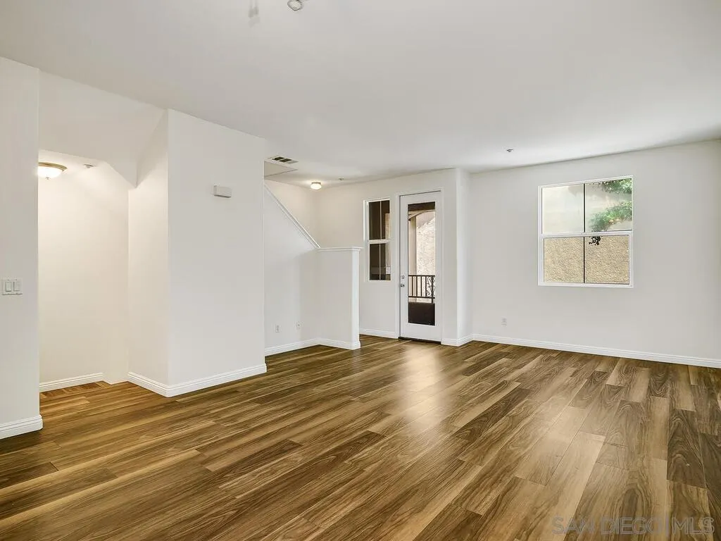 10214 Daybreak Lane, Unit 5 Santee, CA 92071 - Photo 3 of 38 a view of empty room with wooden floor and fan