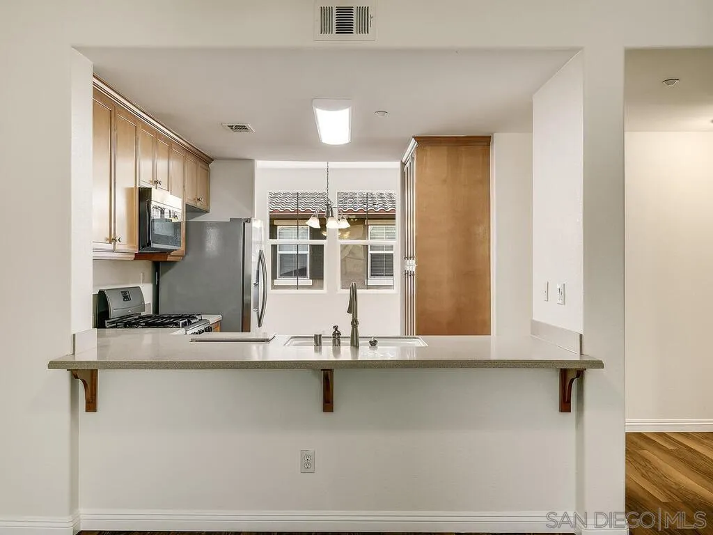 10214 Daybreak Lane, Unit 5 Santee, CA 92071 - Photo 8 of 38 a view of kitchen with stainless steel appliances granite countertop refrigerator sink and stove