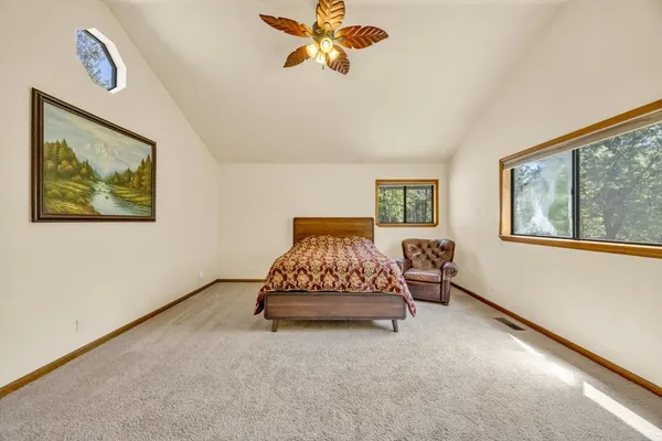 a bedroom with bed and window